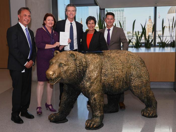 Governor Gavin Newsom, center, signed Senate Bill 447 Wednesday and was joined by, from left, Assemblymember Rick Chavez Zbur, Senate President pro Tempore Toni Atkins, Senator Susan Talamantes Eggman and Assemblymember Chris Ward. Photo: Courtesy Governor's office